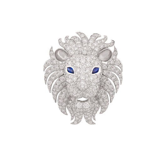Lion head jewelry piece with diamond details on a white background