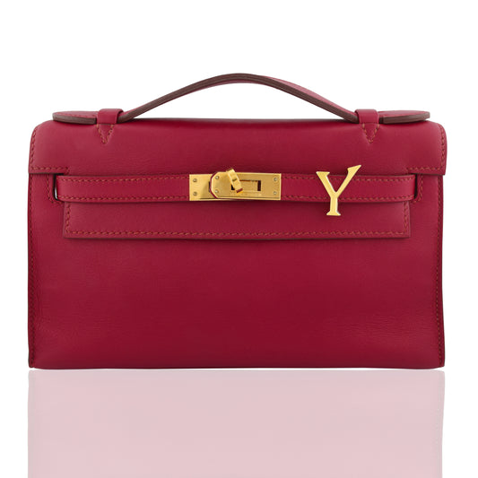 Red handbag with gold lock on a white background, collection-preview