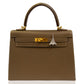 Brown handbag with a silver Eiffel Tower charm on a white background, collection-preview