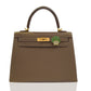 Brown handbag with a green and gold emblem on a white background, collection-preview