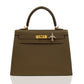 Brown handbag with gold hardware on a white background, collection-preview
