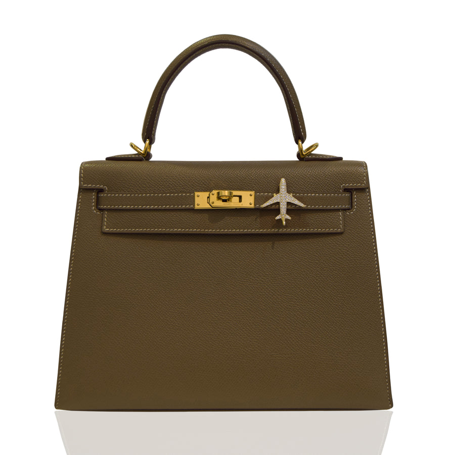 Brown handbag with gold hardware on a white background, collection-preview
