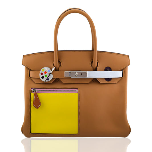 Brown leather handbag with a yellow patch and silver hardware on a white background, collection-preview