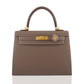 Brown handbag with gold hardware and a decorative clasp on a white background, collection-preview