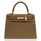 Brown handbag with gold hardware on a white background, collection-preview