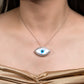 Necklace with an evil eye-shaped pendant