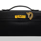 Black leather briefcase with gold accents on a white background, collection-preview