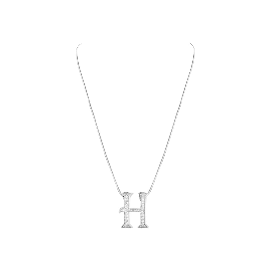 Silver necklace with a 'H' pendant on a white background