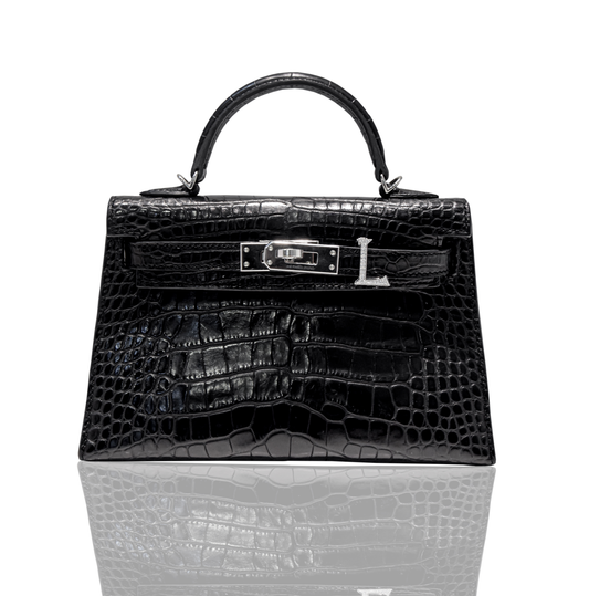 A black handbag with a crocodile pattern and a metallic clasp with the letter 'L' on it, collection-preview.