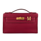 Red handbag with gold hardware on a white background, collection-preview