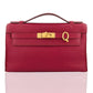 Red handbag with gold clasp on a white background, collection-preview