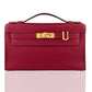 Red handbag with a gold clasp on a white background, collection-preview
