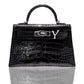 A black handbag with a crocodile pattern and a natural diamond-encrusted 'Y' letter set in a metallic clasp, collection-preview.