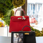 Red and black Kelly bags