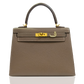 Brown handbag with gold hardware on a white background, collection-preview