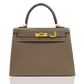 Brown handbag with gold hardware on a white background, collection-preview