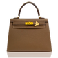 Brown handbag with gold hardware on a white background, collection-preview