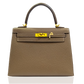 Brown handbag with gold hardware on a white background, collection-preview