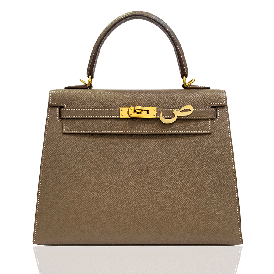 Brown handbag with gold hardware on a white background, collection-preview